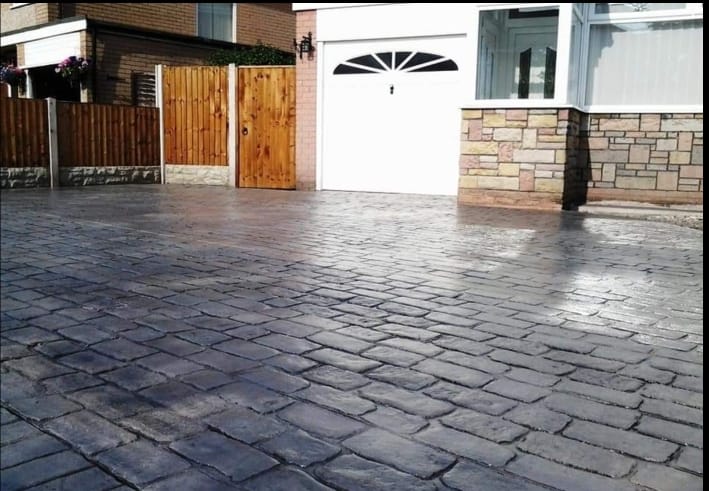 Large slate grey resealed driveway with double garage